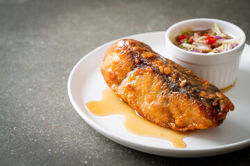 fried snapper fish with fish sauce and spicy salad