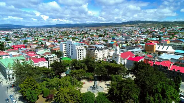 Aerial Forward Shot Of Monumento Hernando De Magallanes Monument In City On Sunny Day - Punta Arenas, Chile