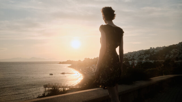 Woman on the observation deck looking at the sea