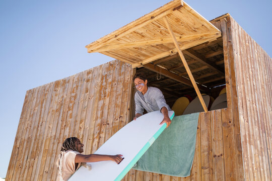surf shop workers - Powered by Adobe