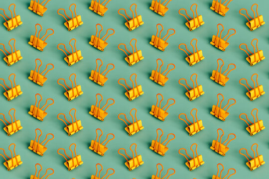 yellow paperclips. a pattern
