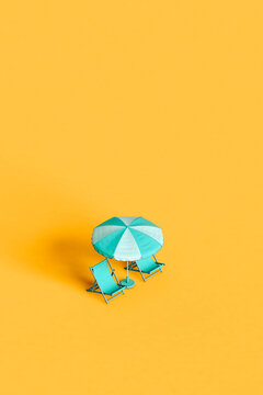 Blue Beach Umbrella And Chairs