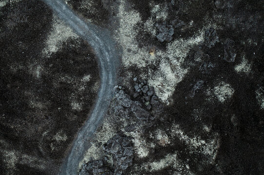 From above texture of volcano rocks and sand from lava at Mount Batur