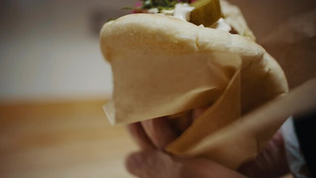 Chef wrapping up finished falafel pita