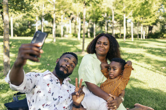 Family taking a selfie with smartphone