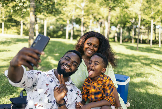 Family taking a selfie with smartphone