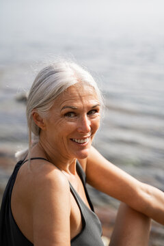 Portrait of happy mature woman at the beach