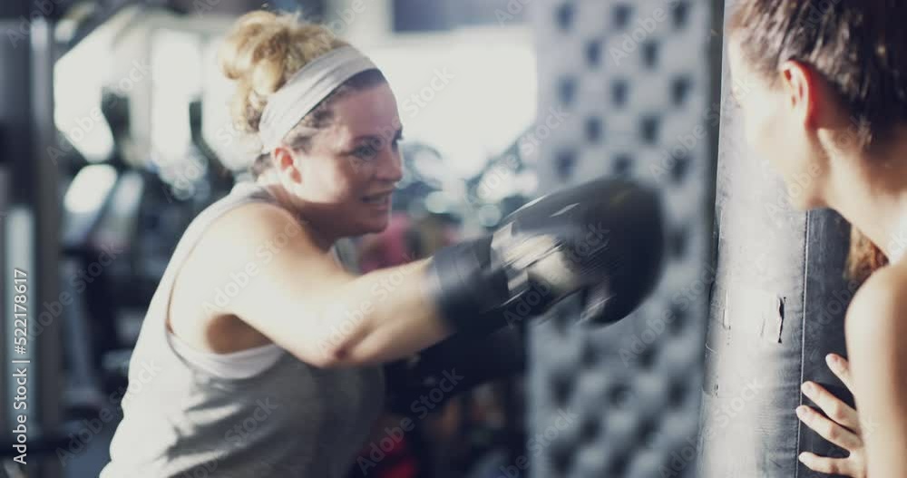 Sticker Chubby, overweight and active woman boxing during an intense workout at the gym with her fitness trainer. Sweaty, active and dedicated female wearing sports gloves while exercising for weightloss