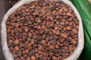 Photograph of roasted broads beans in a local market in Peru. Traditional food concept.