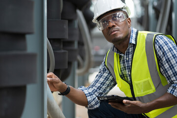 African American male plumber worker check or maintenance sewer pipes network system at...
