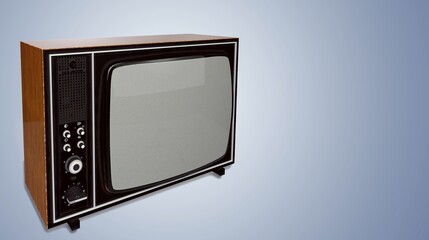 An old retro TV standing in front of the wall in the room. Antique and vintage television images.
