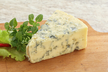 Blue cheese piece over board
