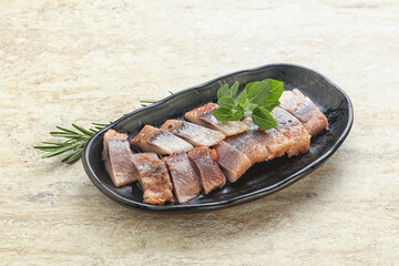 Delicous sliced herring fillet in grape sauce