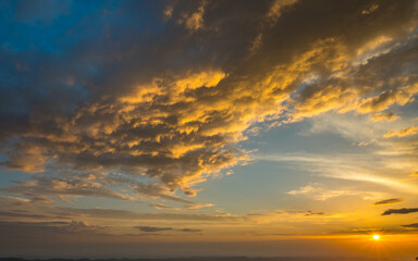 Beautiful cloudy sky during and before golden hour and sunset.