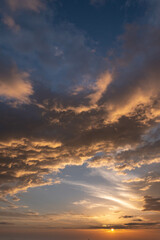 Beautiful cloudy sky during and before golden hour and sunset.
