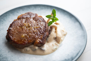 Beef tenderloin with mushroom sauce.