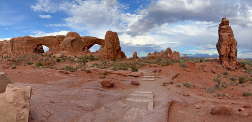Panoramic view of the Windows area in Arches National Park with mountains on the background, Utah