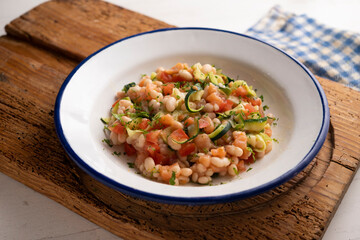 Broad bean salad with zucchini, salmon and tomato.