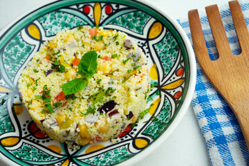 Chickpea salad with vegetables and couscous.
