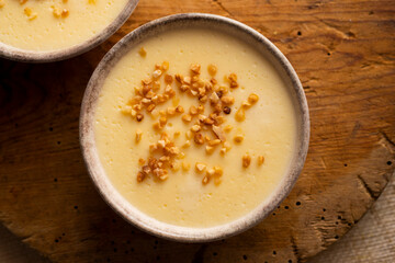 Custard with milk cream and almond crocant.