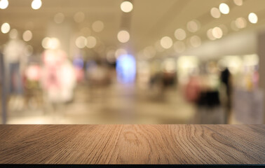 Empty wooden table in front of abstract blurred background of coffee shop . can be used for display or montage your products.Mock up for display of product