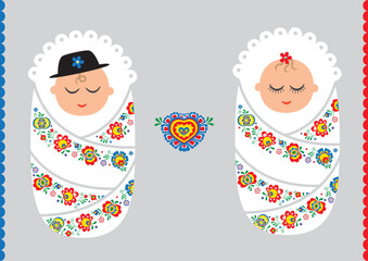 Babies in a swaddler with moravian folklore design - 522186038