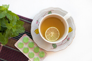 herbal drinks lemon with lozenge for health care arrangement flat lay style on background white 