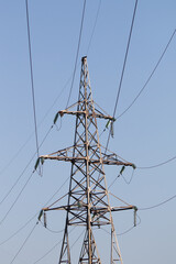 High voltage power line against the sky.