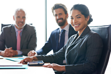 Teamwork, success and development of a business team sitting together in an office. Portrait of a corporate female and lawyer group ready to start a meeting. Modern workplace workers with a smile