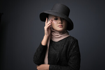 Portrait of a female  wearing a hijab, a form of lifestyle garments for Muslim women, isolated on...
