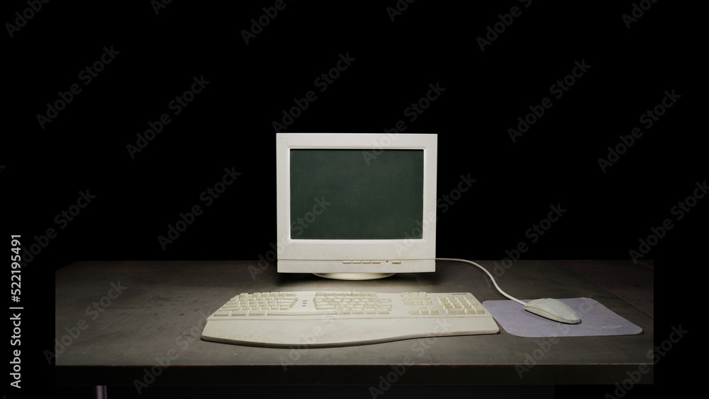 Fototapete old dirty computer monitor sitting on a dark table on a black background. with a vintage mouse, mous