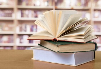 A simple composition of many books, stack or pile of books on wooden table concept