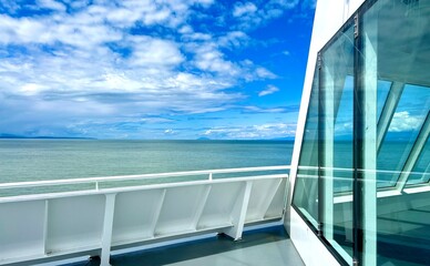 the view from the deck of the covering ship to the sea or ocean is visible Horizon clear blue color of water and sky can be used as a background For title text or advertising calm rest and relaxation