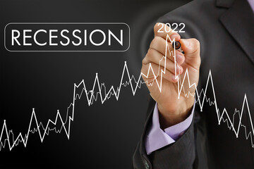 Economic crisis, Businessman using mobile smartphone analyzing sales data and economic graph chart that is falling, stock market crash caused.