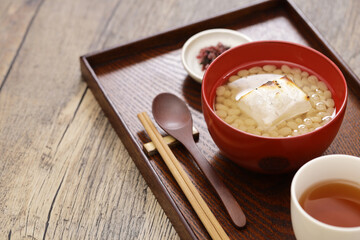 white adzuki Zenzai ( sweet beans soup with baked rice cake), a Japanese dessert