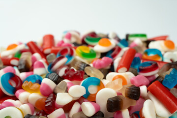 Tasty mix of jelly colorful candies isolated on a white background.
