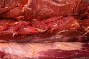 Raw pork tenderloin isolated on a white background.
