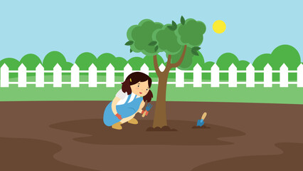 Obraz na płótnie Canvas Girl planted a tree in the garden