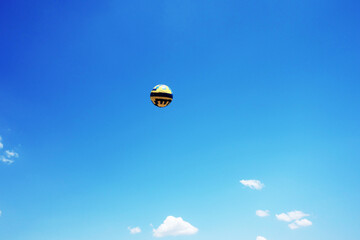 football ball up in the clear sunny summer sky