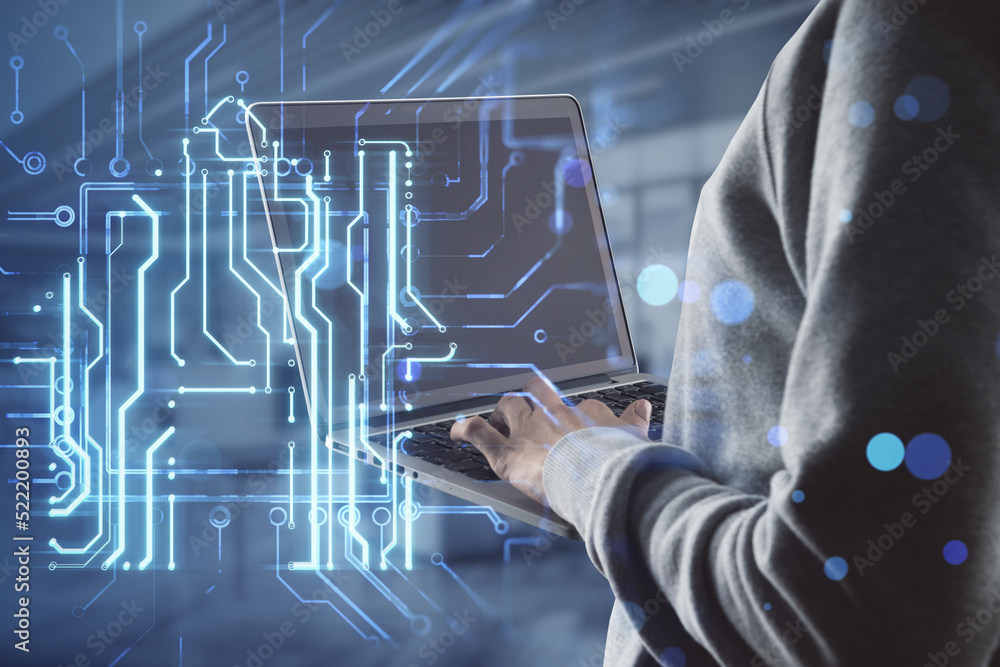 Poster hacker hands holding laptop keyboard with creative house chip circuit hologram on blurry office inte