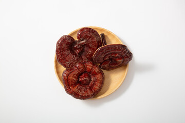 Dried lingzhi mushroom on white background. traditional medicine herbal herb. Ling Zhi has been used in traditional medicine.