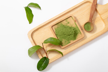Concept of japanese tea with matcha Tea, powder, and green leaves isolated on white.