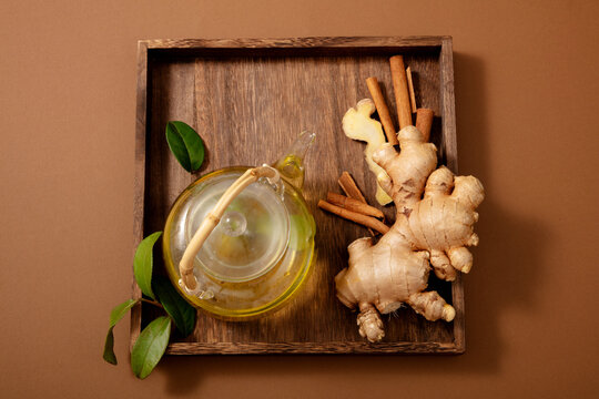 Glass teapot with honey, ginger and cinnamon and honey on a dark background. ingredient organic with for health sweet and natural delicious tasty. - Powered by Adobe