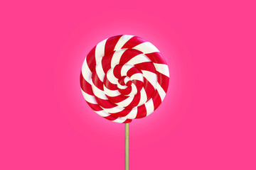 Isolated candies,spiral caramel of red and white color.A Swirling Pattern Of Sweet Caramel.Twisted...