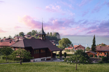 Fototapeta na wymiar Beautiful swiss landscape. Cathedral in Iseltwald village on Brienzersee lake.