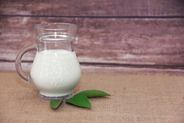 white fermented milk drink ayran in a transparent glass mug