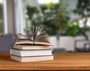 A simple composition of many books, stack or pile of books on wooden table concept