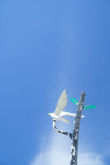 white cross on blue sky
