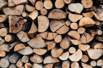 View of a Stack of Firewood. Background of Dry Chopped Logs in a Woodpile. Natural Texture. Preparation of Firewood for the Cold Winter