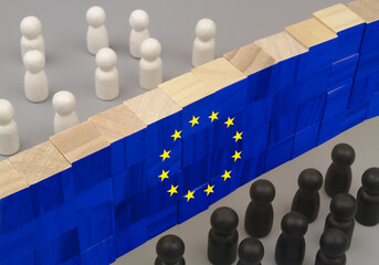 Prevention people migration and separation concept. White and black people figures separated by...